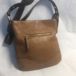 Light brown Coach handbag with three pockets
